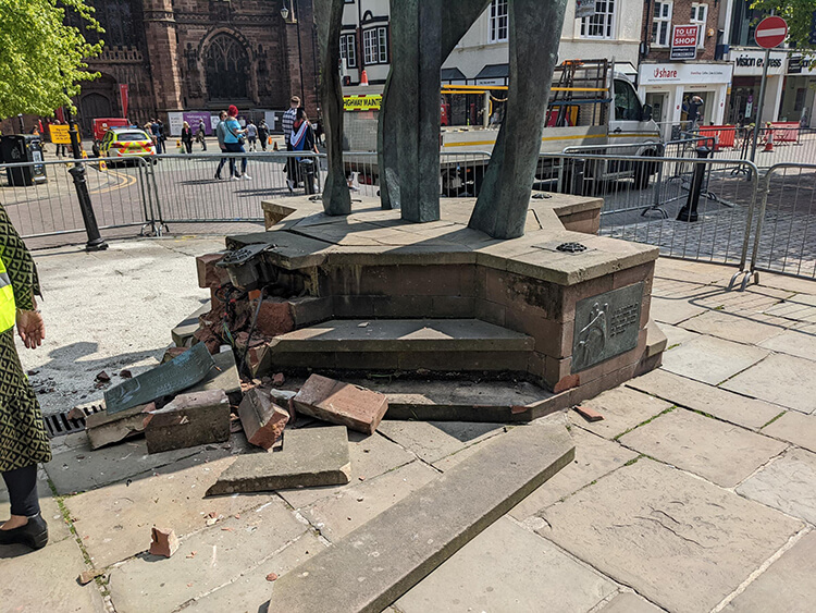 The smashed base of the statue